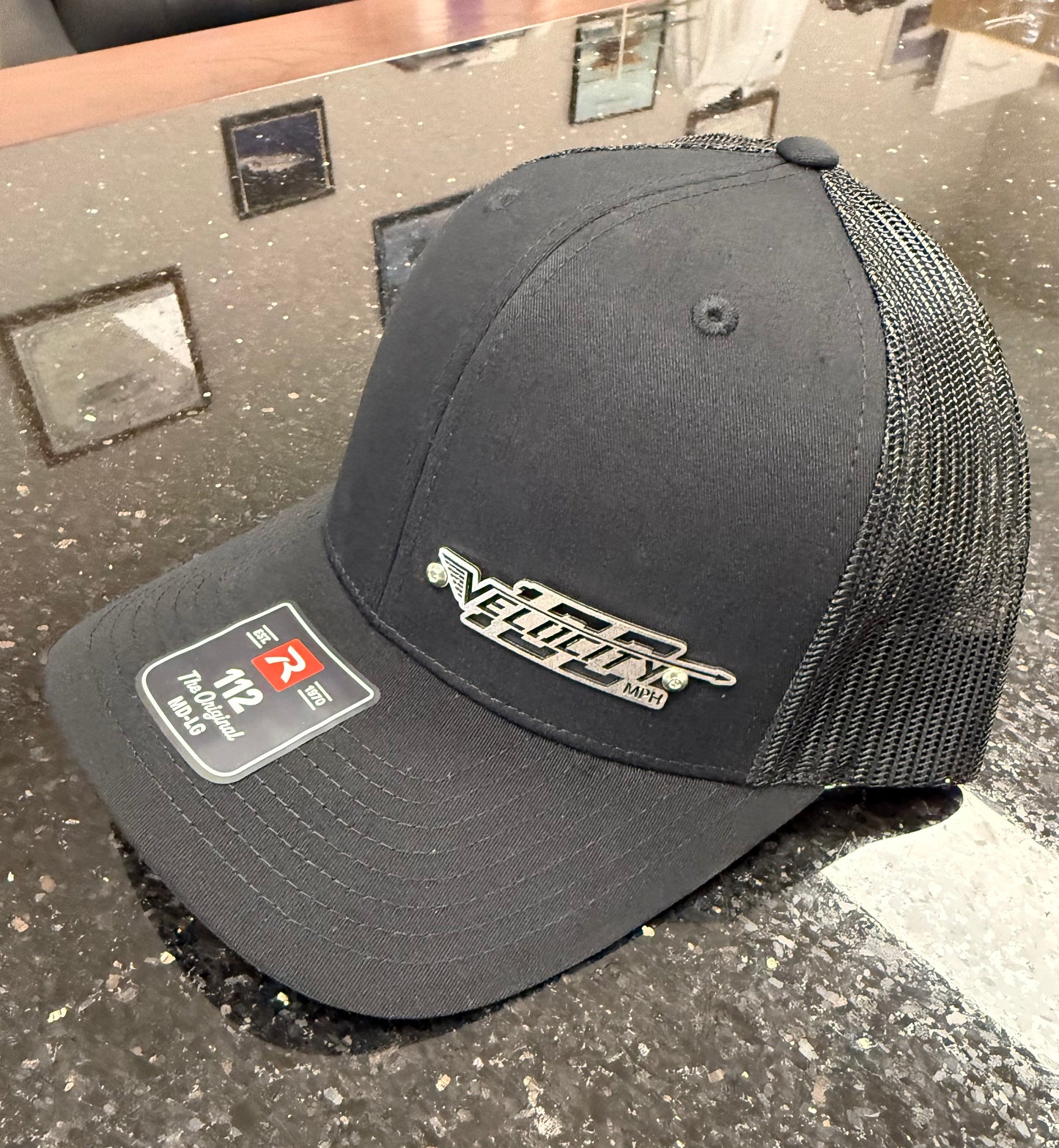 Velocity 100 Billet Logo Cap with snap back. Trucker-style hat.