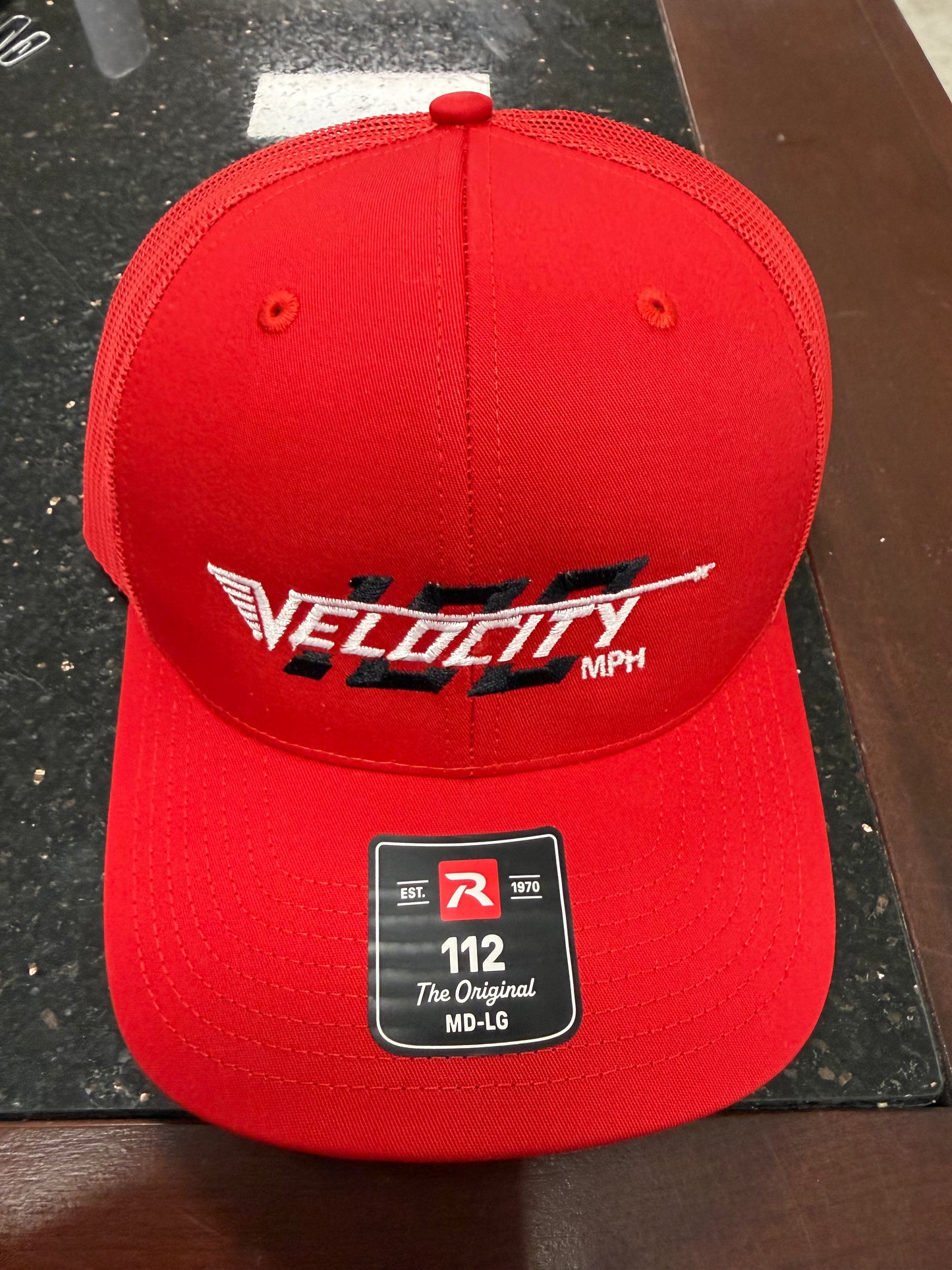 Velocity 100 Red hat with snap back. Trucker-style hat.