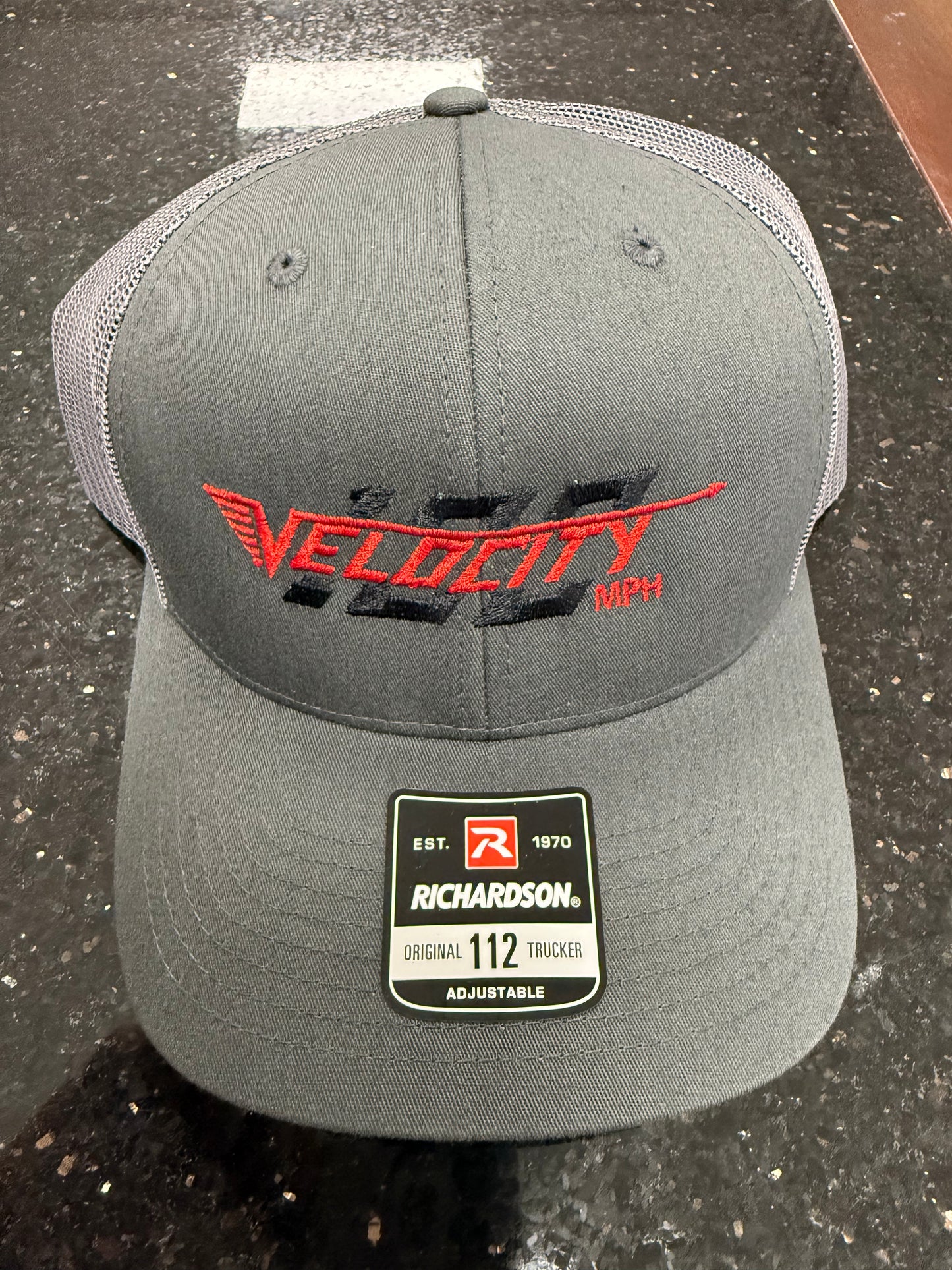Velocity 100 Red hat with snap back. Trucker-style hat.