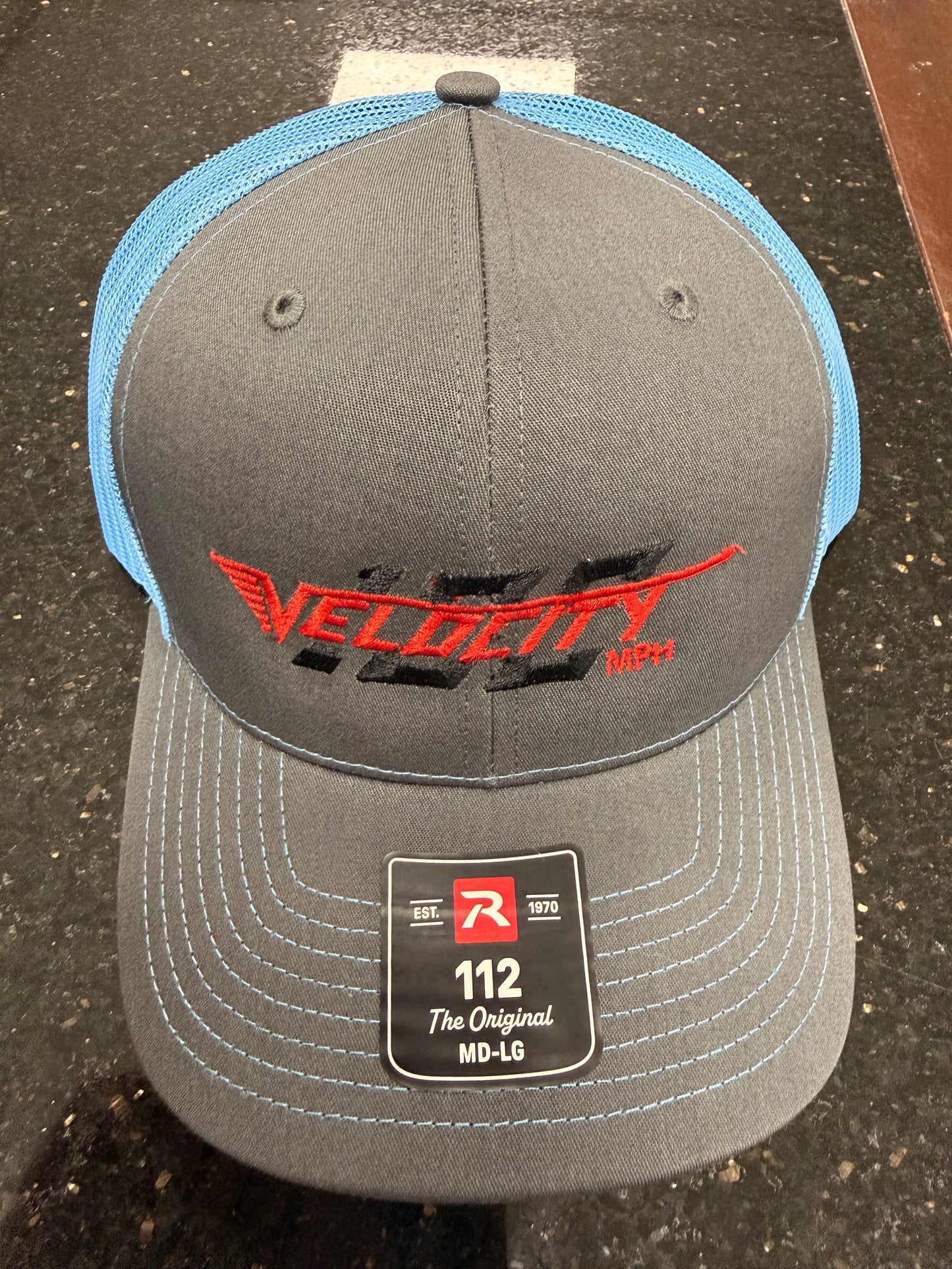 Velocity 100 Red hat with snap back. Trucker-style hat.