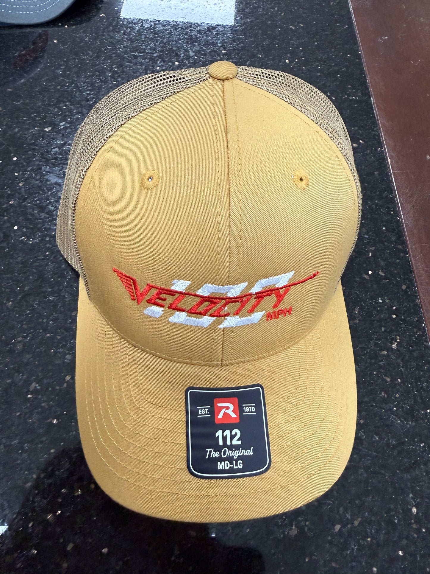 Velocity 100 Red hat with snap back. Trucker-style hat.