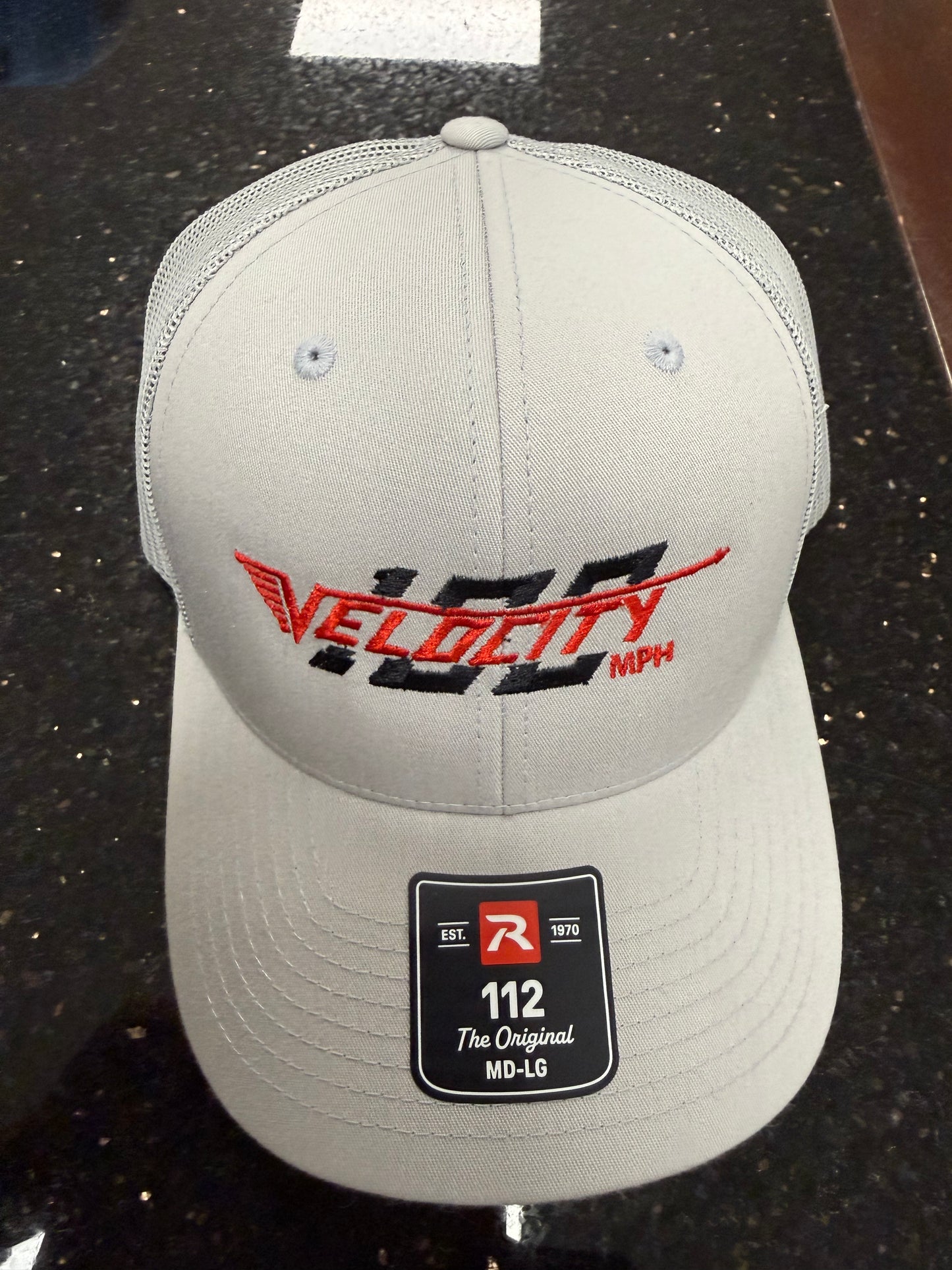 Velocity 100 Red hat with snap back. Trucker-style hat.